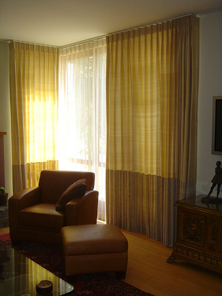 Silk drapes warm a contemporary environment